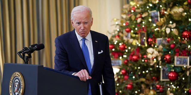 President Joe Biden listens to a question as he speaks about the country's fight against COVID-19 at the White House Dec. 21, 2021. 