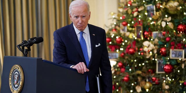 President Biden listens to a question as he speaks about the country's fight against COVID-19 at the White House in Washington, Dec. 21, 2021. REUTERS/Kevin Lamarque