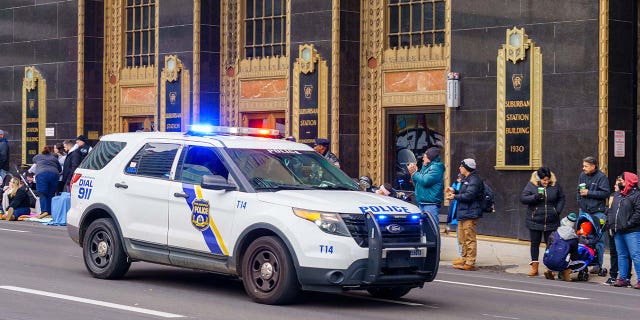 Philadelphia, PA, USA - November 25, 2021: A Philadelphia Police Department marked vehicle with its emergency light activated.
