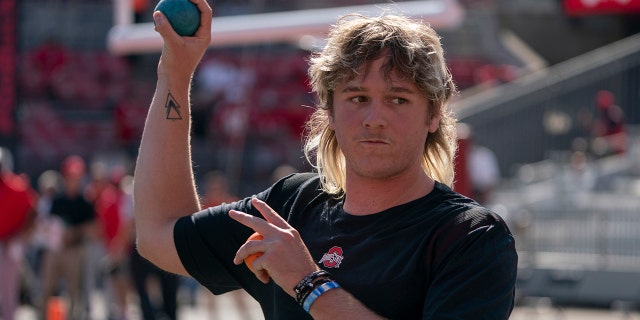 COLUMBUS, OH - SEPTEMBER 11: Quarterback Quinn Ewers #3 of the Ohio State Buckeyes warming up before the game between the Ohio State Buckeyes and the Oregon Ducks at Ohio Stadium in Columbus, Ohio on September 11, 2021.