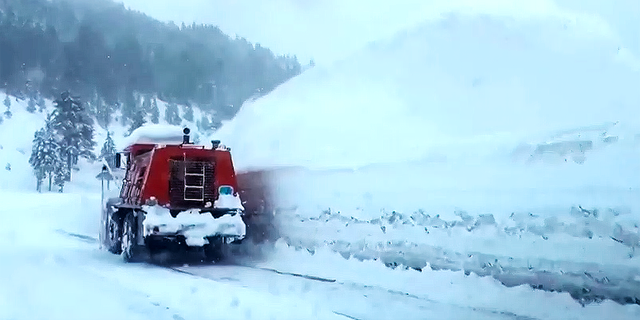 A vehicle clears snow along Interstate-80 in the Lake Tahoe region this week.