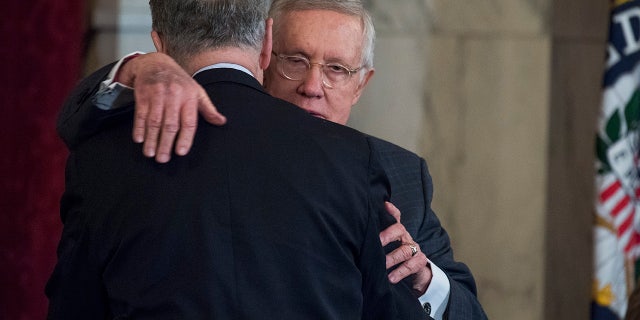 FILE 2016: Then-Senate Minority Leader Harry Reid, D-Nevada, hugs incoming Senate Minority Leader Charles Schumer, D-N.Y. (Photo By Tom Williams/CQ Roll Call)