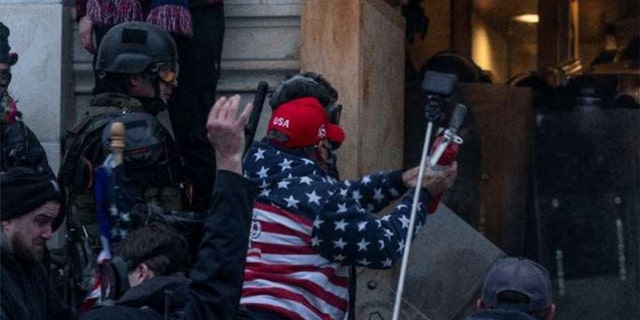 Robert Palmer, 54, of Largo, Florida, seen wearing an American flag jacket, was sentenced to 63 months behind bars Dec. 17, 2021, for his role in the Jan. 6 Capitol riot.