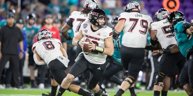 Coastal Carolina quarterback Bryce Carpenter (12) rolls out to throw the ball against Northern Illinois during the Cure Bowl in Orlando, Fla., Friday, Dec. 17, 2021.