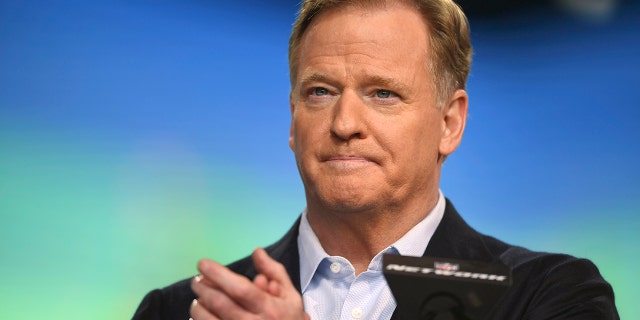 FILE - NFL Commissioner Roger Goodell announces the start of the second round of the NFL football draft, Friday, April 30, 2021, in Cleveland. Only unvaccinated players and those experiencing possible symptoms of COVID-19 will be tested, starting Sunday, Dec. 19, under the NFL’s revised protocols