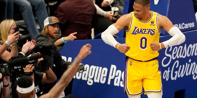 LeBron James, Anthony Davis offer advice to struggling Russell Westbrook 3 Los Angeles Lakers' Russell Westbrook (0) celebrates after sinking a basket as fans look on in the second half of an NBA basketball game in Dallas, Wednesday, Dec. 15, 2021.