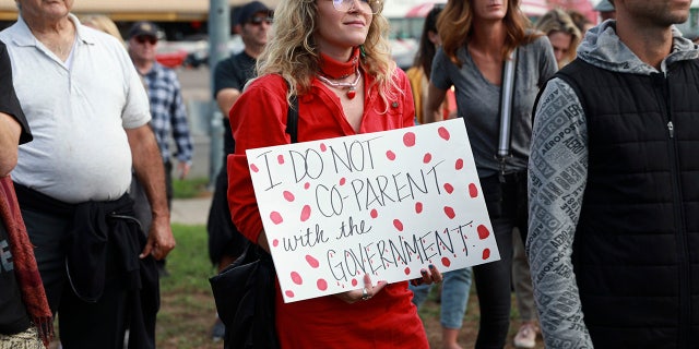 Anti-vaccine protesters stage a protest outside of the San Diego Unified School District office to protest a forced vaccination mandate for students on September 28, 2021 in San Diego, California.
