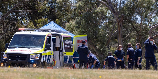 信用: AAP Image Emergency services personnel inspect the scene at Hillcrest Primary School. Five children have died and four are being treated in hospital, with some critically injured, after a bouncy castle accident in the Australian state of Tasmania, police said on Thursday.