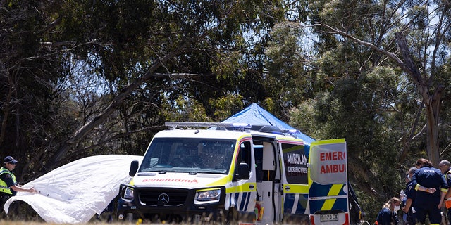 Credit: AAP Image Emergency services personnel inspect the scene at Hillcrest Primary School. Five children have died and four are being treated in hospital, with some critically injured, after a bouncy castle accident in the Australian state of Tasmania, police said on Thursday.