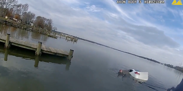 The 25-year-old woman's white sedan was completely submerged before officers could get her out of the vehicle.