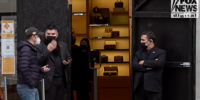 <strong>Guards stand outside the Louis Vuitton store in San Francisco's Union Square</strong>