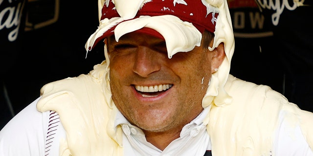 Head coach Shane Beamer of the South Carolina Gamecocks is covered in Duke's Mayonnaise following their 38-21 victory over the North Carolina Tar Heels in the Duke's Mayo Bowl at Bank of America Stadium on December 30, 2021 in Charlotte, North Carolina.