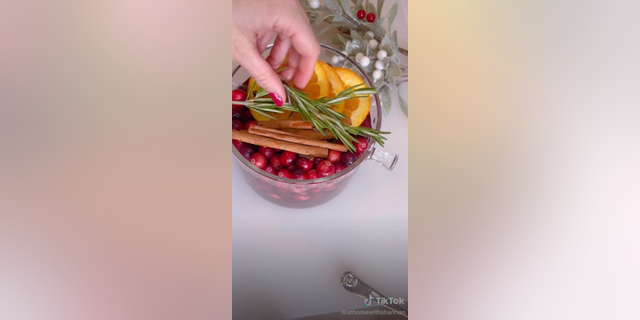 Shannon Doherty makes her Christmastime fragrance with water, cranberries, orange slices, cinnamon sticks, cloves and rosemary.