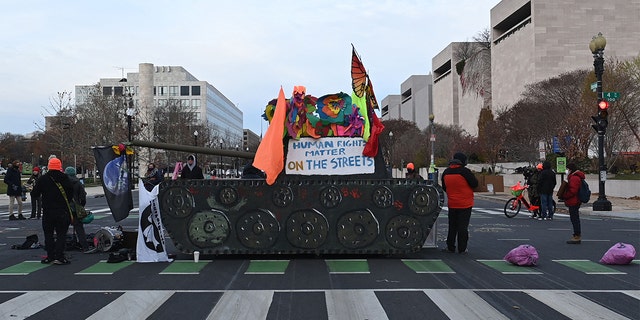 Activists block streets near the U.S. Capitol in Washington on Dec. 7, 2021.  