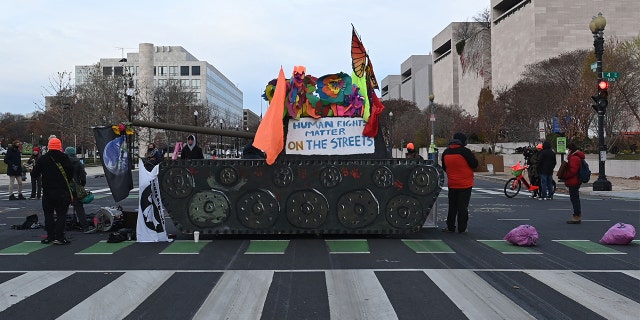 Activists block streets near the U.S. Capitol in Washington on Dec. 7, 2021.