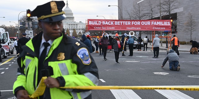 Activists block streets near the U.S. Capitol in Washington, on Dec. 7, 2021.