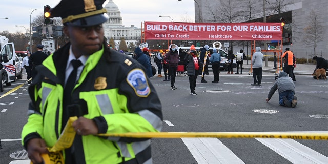 Activists block streets near the U.S. Capitol in Washington, on Dec. 7, 2021.