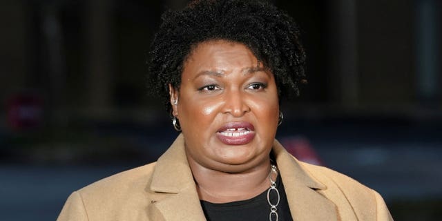FILE PHOTO: Stacey Abrams speaks to the media about the U.S. Senate runoff elections outside St. Paul's Episcopal Church in Atlanta, Georgia, U.S., January 5, 2021. REUTERS/Elijah Nouvelage/File Photo