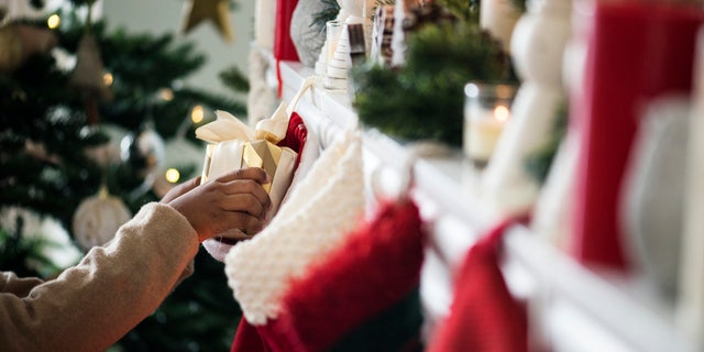 The tradition of hanging stockings reportedly comes from a legend about Saint Nicholas.