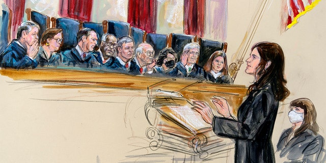 This artist sketch depicts Center for Reproductive Rights Litigation Director Julie Rikelman speaking to the Supreme Court, Wednesday, Dec. 1, 2021, in Washington. Seated to Rikelman's right is Solicitor General Elizabeth Prelogar. Justices seated from left are Brett Kavanaugh, Elena Kagan, Samuel Alito, Clarence Thomas, Chief Justice John Roberts, Stephen Breyer, Sonia Sotomayor,  Neil Gorsuch and Amy Coney Barrett.