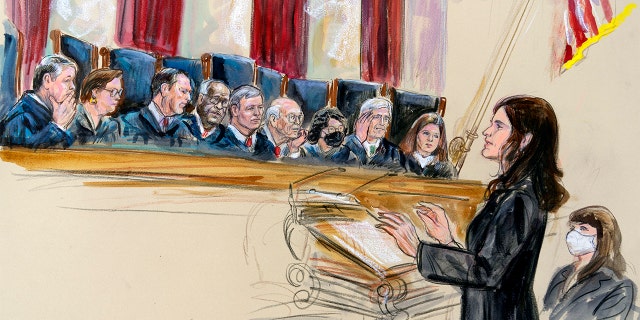 This artist sketch depicts Center for Reproductive Rights Litigation Director Julie Rikelman speaking to the Supreme Court, Wednesday, Dec. 1, 2021, in Washington. Seated to Rikelman's right is Solicitor General Elizabeth Prelogar. Justices seated from left are Brett Kavanaugh, Elena Kagan, Samuel Alito, Clarence Thomas, Chief Justice John Roberts, Stephen Breyer, Sonia Sotomayor, Neil Gorsuch and Amy Coney Barrett.