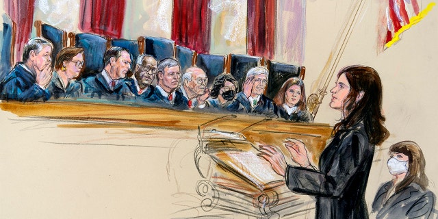 This artist sketch depicts Center for Reproductive Rights Litigation Director Julie Rikelman speaking to the Supreme Court, Wednesday, Dec. 1, 2021, in Washington. Seated to Rikelman's right is Solicitor General Elizabeth Prelogar. Justices seated from left are Brett Kavanaugh, Elena Kagan, Samuel Alito, Clarence Thomas, Chief Justice John Roberts, Stephen Breyer, Sonia Sotomayor,  Neil Gorsuch and Amy Coney Barrett.