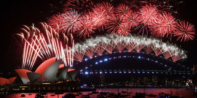 Fireworks explode over the Sydney Opera House and Harbour Bridge during New Year’s Eve celebrations in Sydney, Saturday, Jan. 1, 2022. 