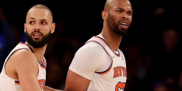 Taj Gibson (67) of the New York Knicks is held back by teammate Evan Fournier (13) after Gibson is called for double technical fouls and is ejected from the game in the first half against the Chicago Bulls at Madison Square Garden Dec. 2, 2021 a New York City.