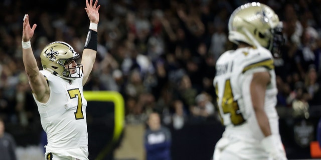 New Orleans Saints quarterback Taysom Hill (7) celebrates a touchdown against the Dallas Cowboys during the first half of an NFL football game, Thursday, Dec. 2, 2021, in New Orleans.
