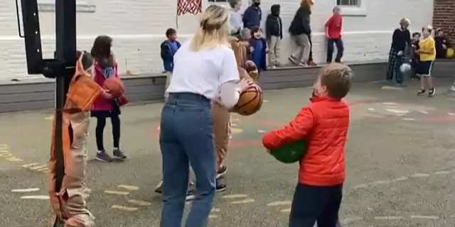 Elementary school teacher Kathleen Fitzpatrick has gone viral after she put hot chocolate on the line with a basketball shot.