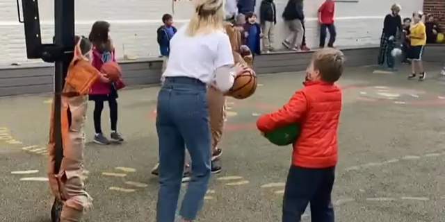 Elementary school teacher Kathleen Fitzpatrick has gone viral after she put hot chocolate on the line with a basketball shot.