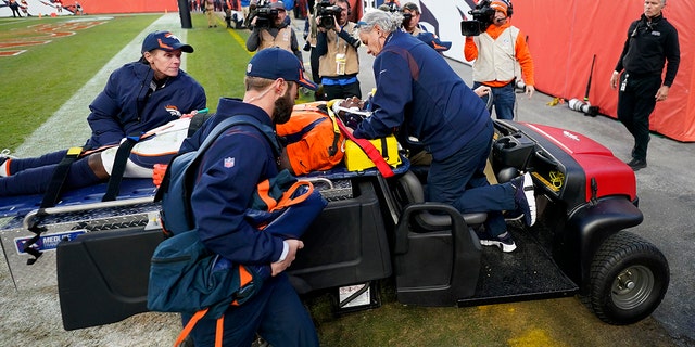 Denver Broncos quarterback Teddy Bridgewater is carted off the field after being injured against the Cincinnati Bengals during the second half of an NFL football game, Sunday, Dec. 19, 2021, in Denver.