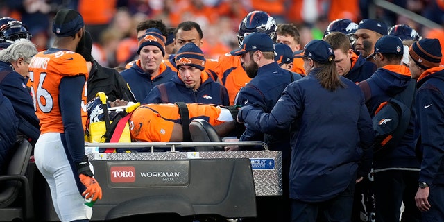 Denver Broncos quarterback Teddy Bridgewater is placed on a cart after being injured against the Cincinnati Bengals during the second half of an NFL football game, Sunday, Dec. 19, 2021, in Denver. 