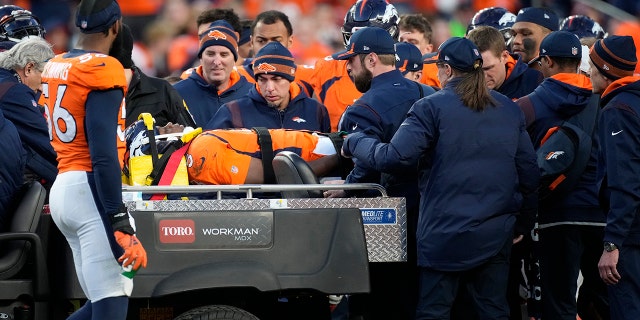 Denver Broncos quarterback Teddy Bridgewater is placed on a cart after being injured against the Cincinnati Bengals during the second half of an NFL football game, Sunday, Dec. 19, 2021, in Denver. 