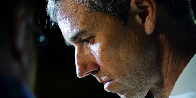 Texas Democratic gubernatorial candidate and former US congressman Beto O'Rourke listens to his staff during his campaign kickoff event in McAllen, Texas, Nov. 17, 2021.