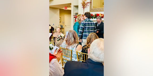 Juanita Courtney has three children, eight grandchildren, 12 great-grandchildren and five great-great-grandchildren with a sixth on the way. Seen in this image photographed on Dec. 24 is Courtney serving as matron of honor at her great-great-granddaughter Ashley Stewart's wedding in Knoxville, Tenn.