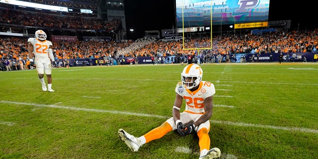 Tennessee defensive back Theo Jackson (26) sits on the field after Purdue kicked a field goal in overtime to win the Music City Bowl NCAA college football game Thursday, Dec. 30, 2021, in Nashville, Tennessee. Purdue won 48-45.