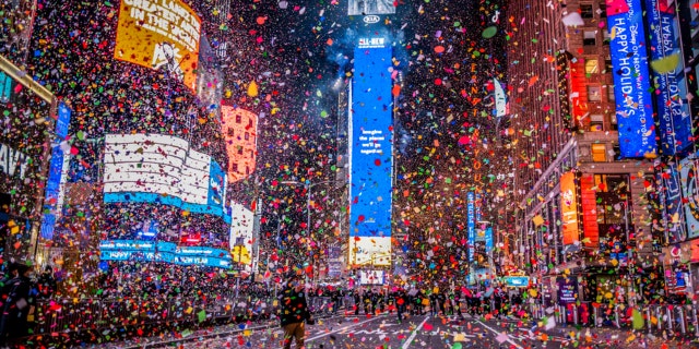 Confetti flies after the Times Square New Year's Eve Ball drops in a nearly empty Times Square due to the COVID-19 lockdown, early Friday, Jan. 1, 2021.
