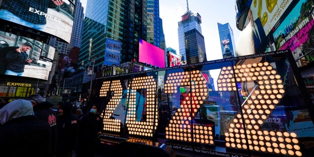 The 2022 sign that will be lit on top of a building on New Year's Eve is displayed in Times Square, New York, Monday, Dec. 20, 2021. Crowds will once again fill New York's Times Square this New Year's Eve, with proof of COVID-19 vaccination required for revelers who want to watch the ball drop in person, Mayor Bill de Blasio announced last week.