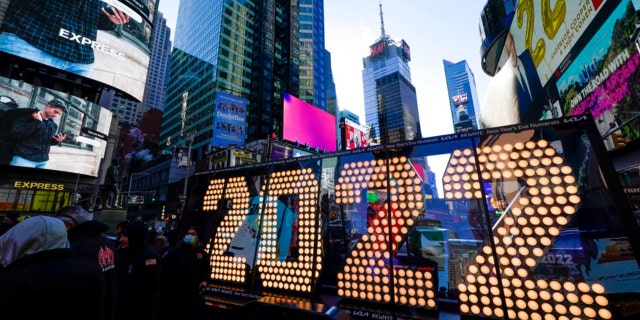 The 2022 sign that will be lit atop a building on New Years Eve is displayed in Times Square, New York on Monday, December 20, 2021. Crowds will once again fill Times Square in New York City this New Years Eve, with a Proof of COVID-19 Vaccination Required for Party Goers Who Want to Watch the Ball Fall in Person, Mayor Bill de Blasio announced last week.