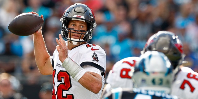 Tom Brady (12) of the Tampa Bay Buccaneers looks to throw during a game against the Carolina Panthers at Bank of America Stadium in Charlotte, N.C., Dec. 26, 2021.