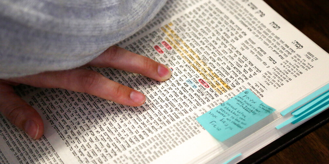 Sarah Rosenberg, an ordination program student, studies in the beit midrash, a space for learning, at Yeshivat Maharat in the Bronx borough of New York, on Wednesday, Dec. 8, 2021.