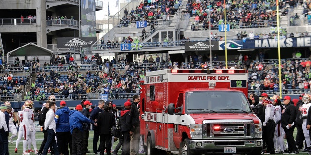 San Francisco 49ers running back Trenton Cannon is loaded into an ambulance after an injury during the first half of an NFL football game against the Seattle Seahawks at Lumen Field, Sunday, Dec. 5, 2021, in Seattle.