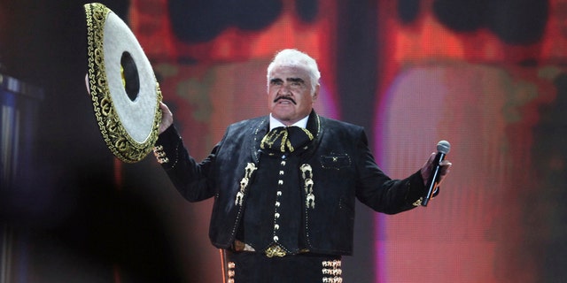 In this file photo of Saturday, April 16, 2016, the Mexican singer Vicente Fernandez performs at a free concert at Azteca Stadium. Fernández, the regional Mexican music star whose powerful voice immortalized songs like "El rey", "Volver, Volver" and "Pity that you are alien" while inspiring new generations of performers like his son Alejandro Fernández Jr., He died early Sunday, Dec. 12, 2021, relatives reported. He was 81 years old. 