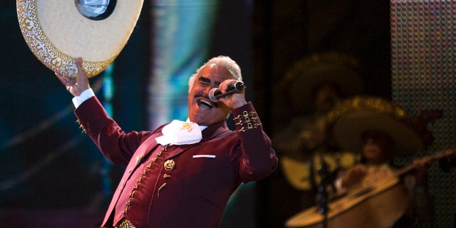 FILE - Vicente Fernandez performs at a free concert during Valentine's Day in Mexico City's on Feb. 14, 2009, file photo, singer. On Tuesday, Oct. 8, 2016. The Mexican singer died Sunday at 81 years of age in Guadalajara, Mexico, his family announced in a statement.