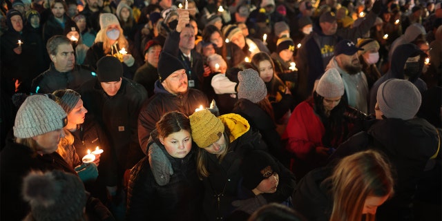 OXFORD, MICHIGAN - DECEMBER 03: People attend a vigil downtown to honor those killed and wounded during the recent shooting at Oxford High School on December 03, 2021 in Oxford, Michigan. Four students were killed and seven others injured on November 30, when student Ethan Crumbley allegedly opened fire with a pistol at the school. Crumbley has been charged in the shooting. Today his parents were also charged. (Photo by Scott Olson/Getty Images)