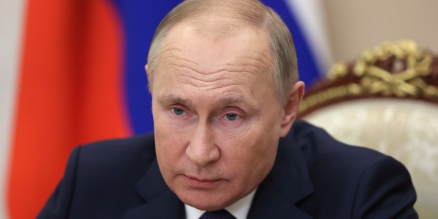 Russian President Vladimir Putin holds a video conference to address participants in a congress of the United Russia party marking the 20th anniversary of the party founding, in Moscow, Russia.