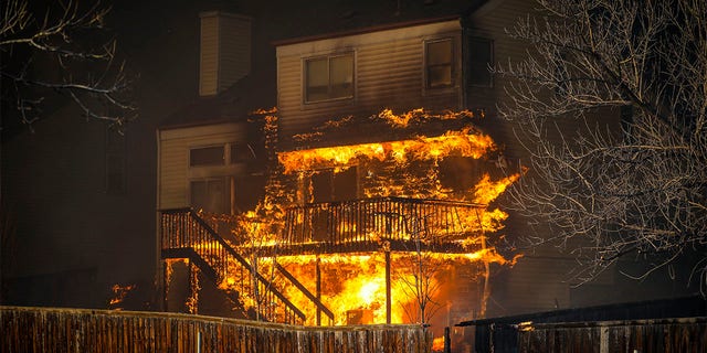 A home burns after a fast moving wildfire swept through the area in the Centennial Heights neighborhood on December 30, 2021 of Louisville, Colorado. (Photo by Marc Piscotty/Getty Images)