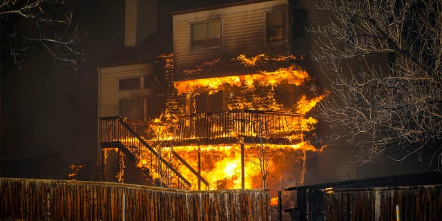 A home burns after a fast moving wildfire swept through the area in the Centennial Heights neighborhood on December 30, 2021 of Louisville, Colorado. (Photo by Marc Piscotty/Getty Images)