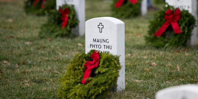 Wreaths lay at the foot of headstones in Section 60 of Arlington National Cemetery.